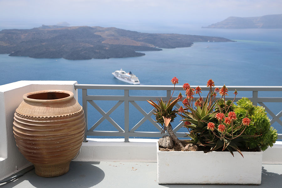 Pottery and succulents with caldera panorama
