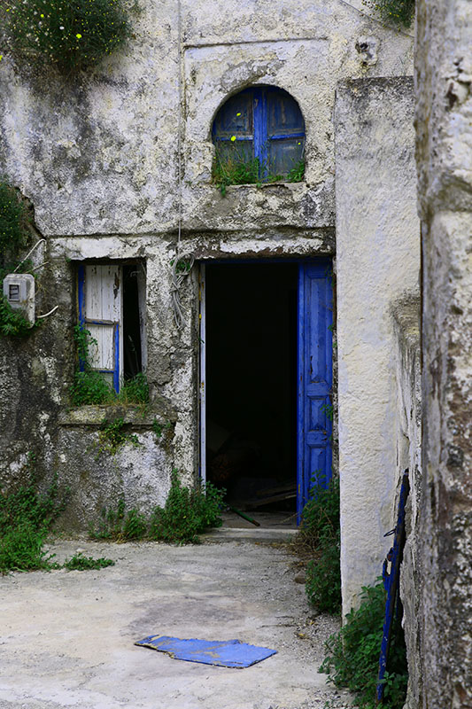 Old building with blue doors in Greece